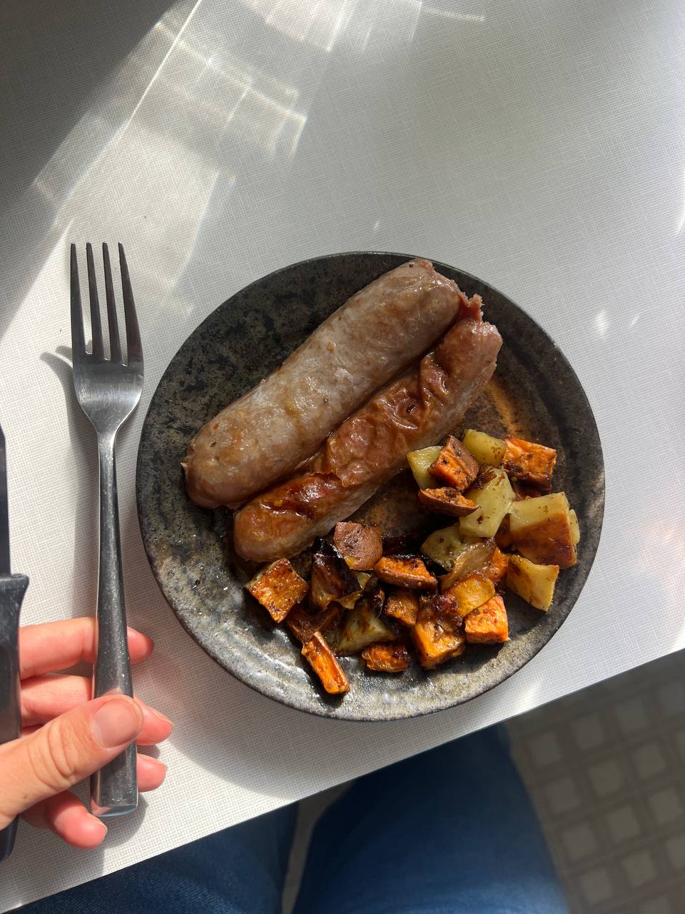 two sausages with roasted potatoes and sweet potatoes