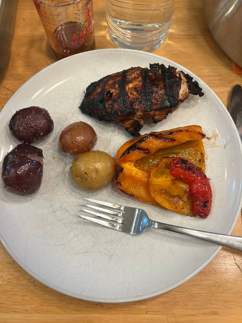 grilled chicken breast, 5 small potatoes, roasted squash, and roasted peppers