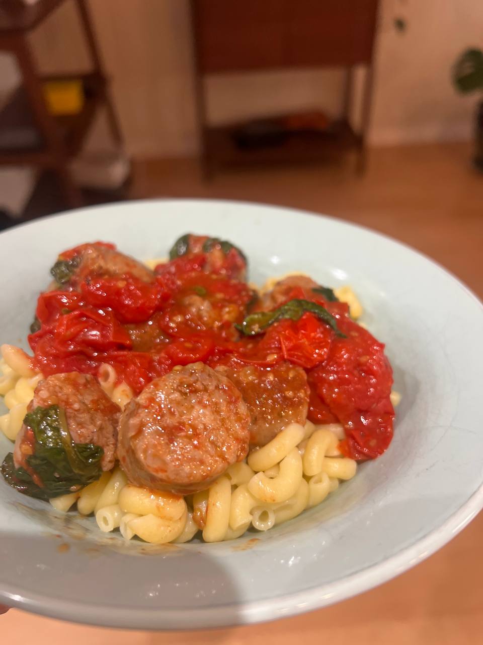 pasta with pork sausage tomato and basil, second view