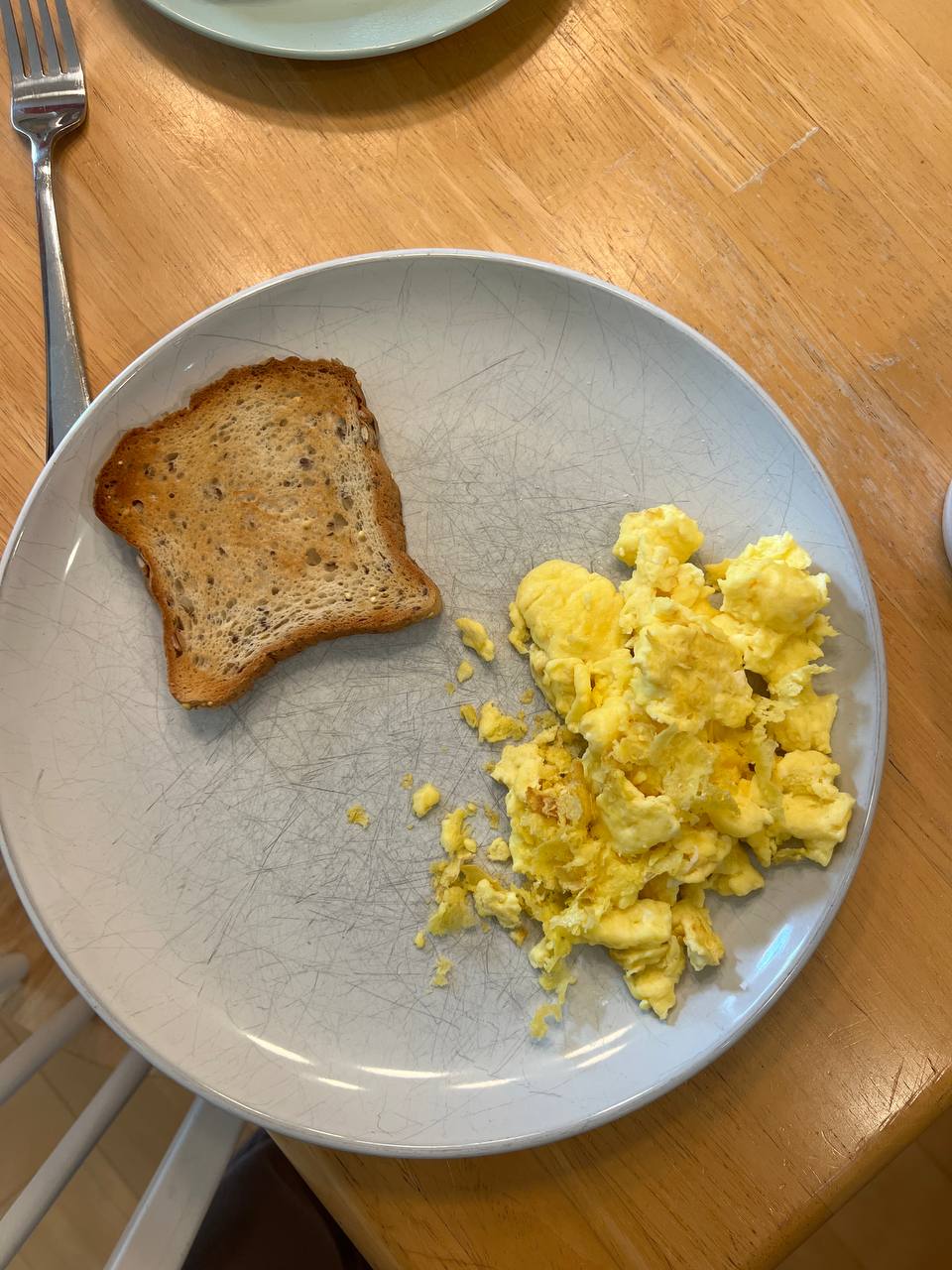 breakfast plate with scrambled eggs and toast