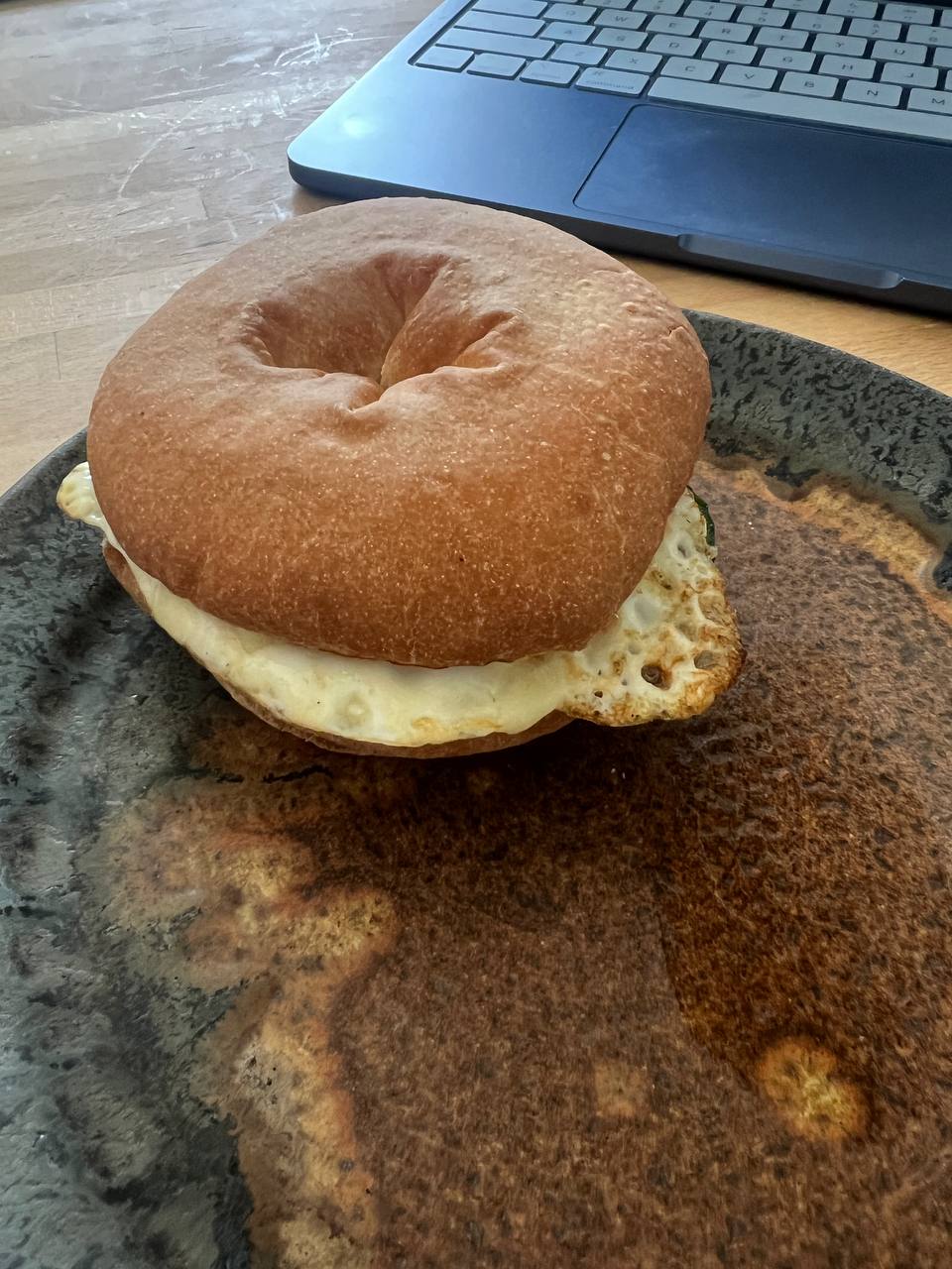 Plain bagel, Fried egg (whole), Cucumber slices, Hummus