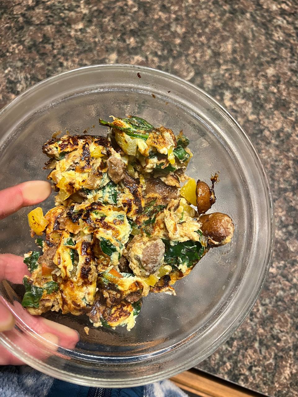 Egg scramble with ground beef, potato, spinach, and peppers